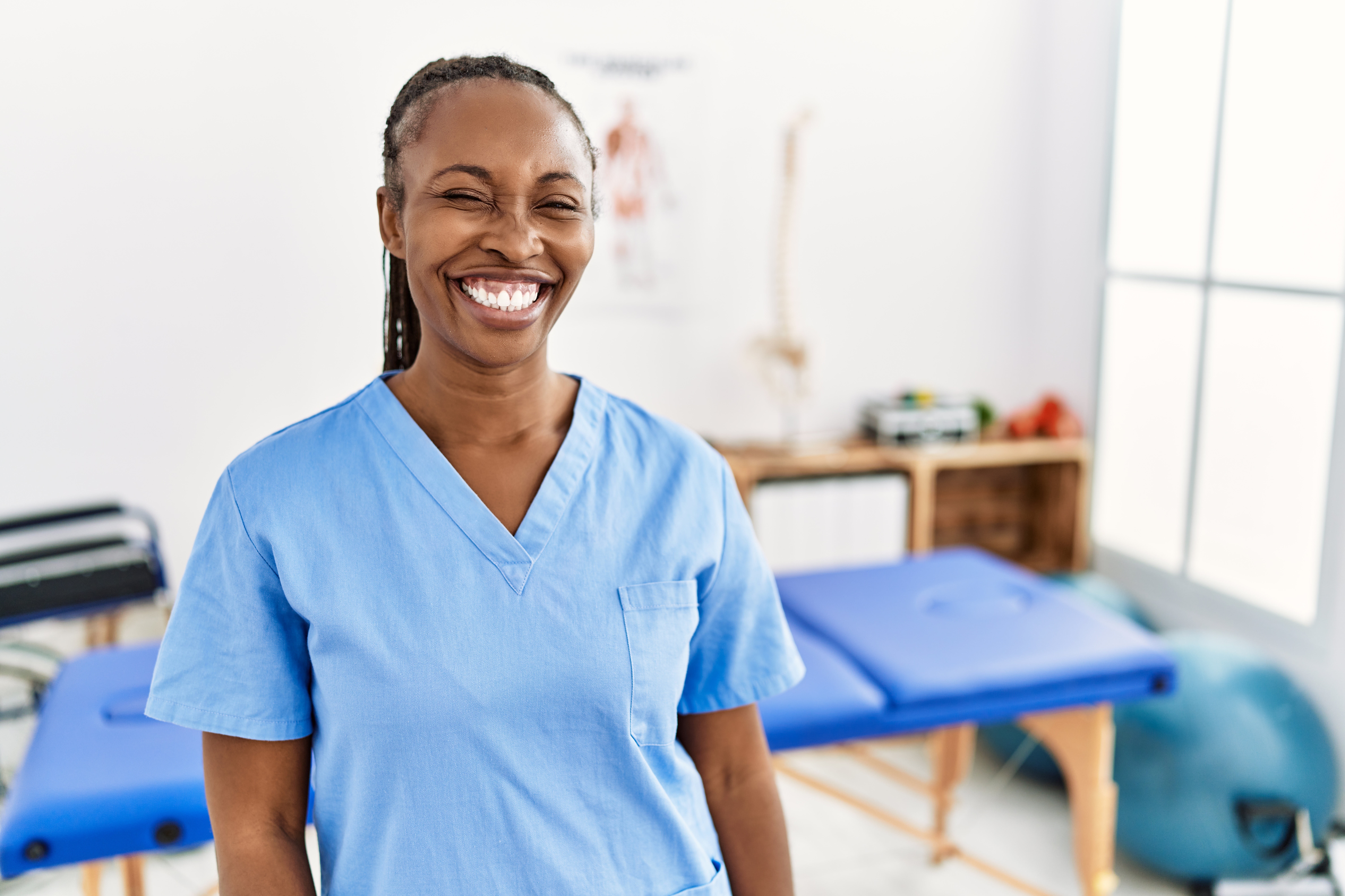 Doctor smiling in scrubs