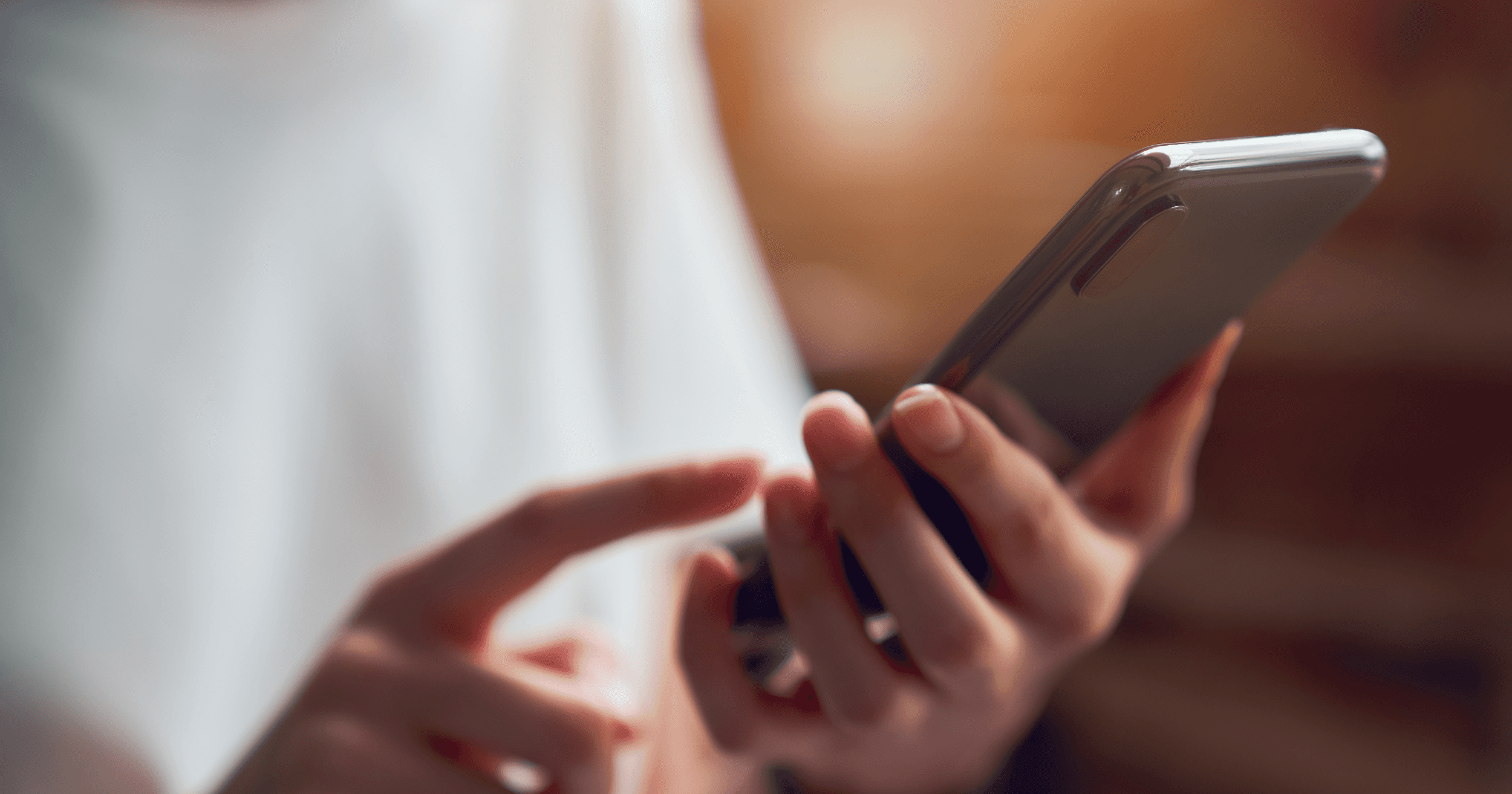 A Malaysian customer typing on her phone