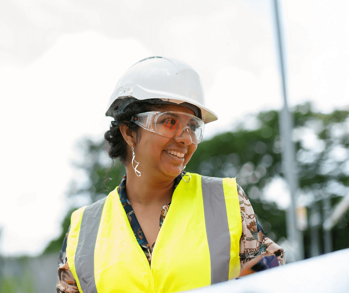 woman in white cap and yellow vest