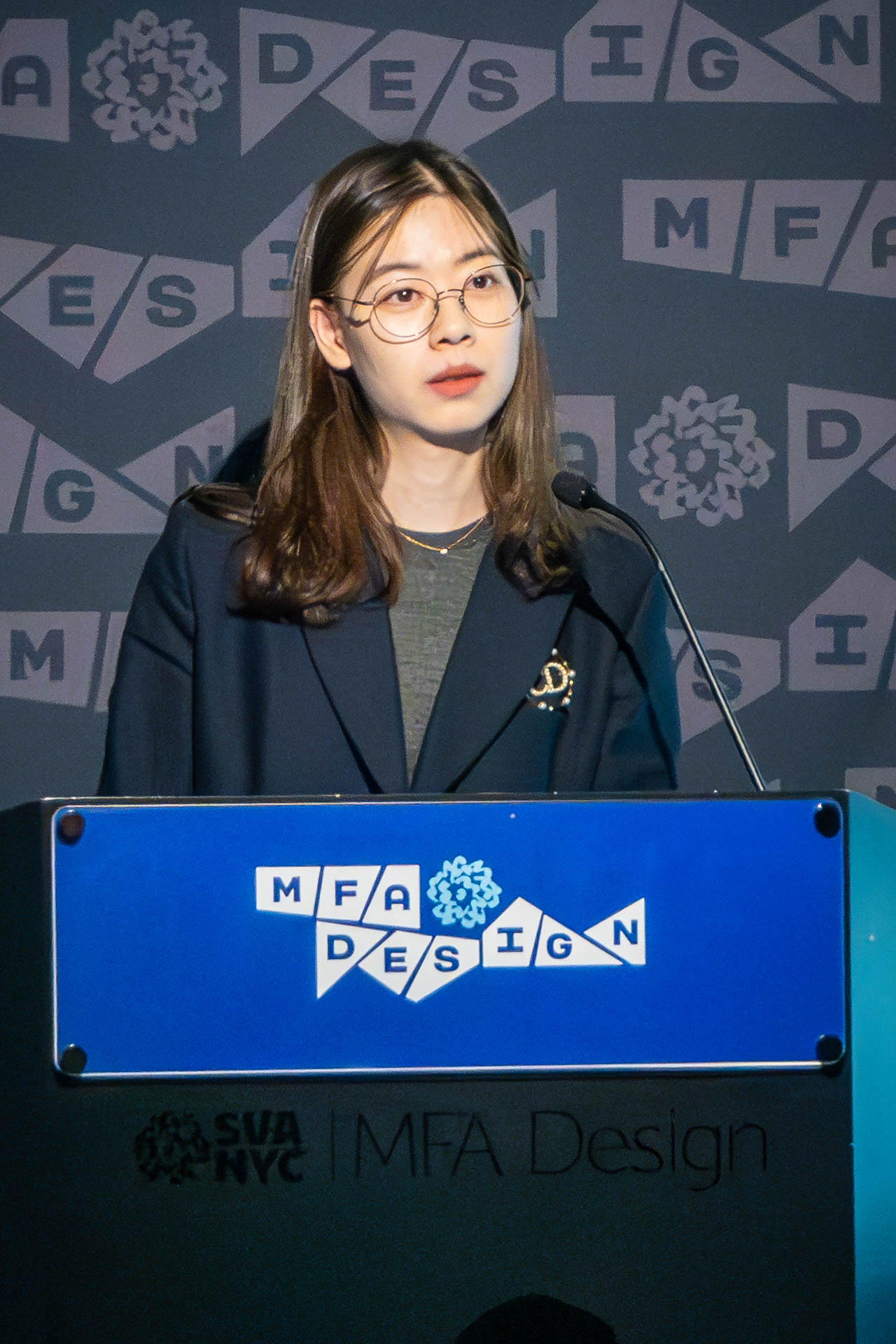 student at a podium giving a presentation