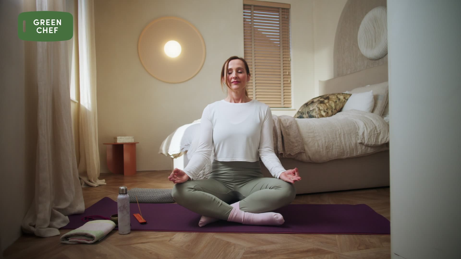 The image captures the ethereal beauty of an underwater cave illuminated by sunbeams penetrating through an opening above.