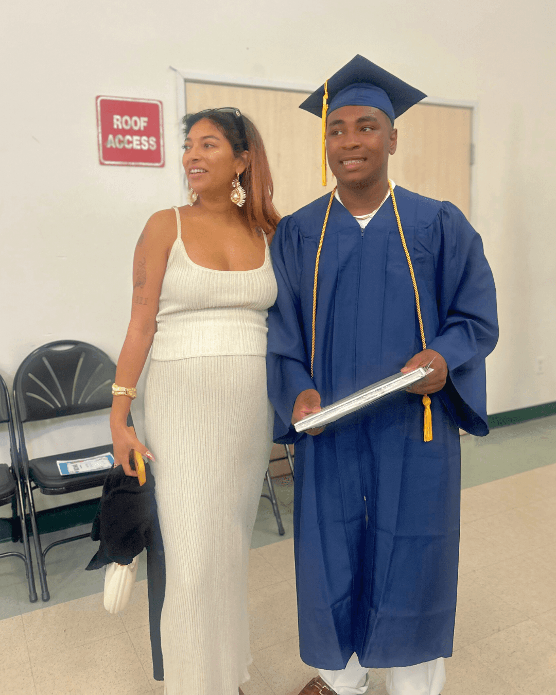 Woman in a hot tub made fo terracotta and blue spanish tile surrounded by green plants