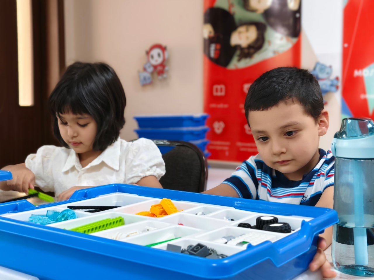 A man stading with Surfboard