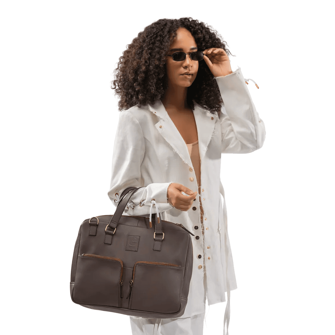 Woman holding a brown bag against a white background