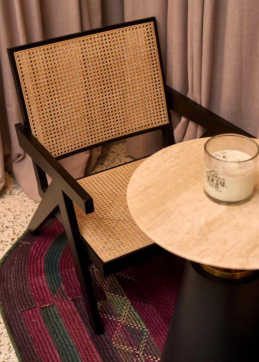 close shot of chair and table with candle