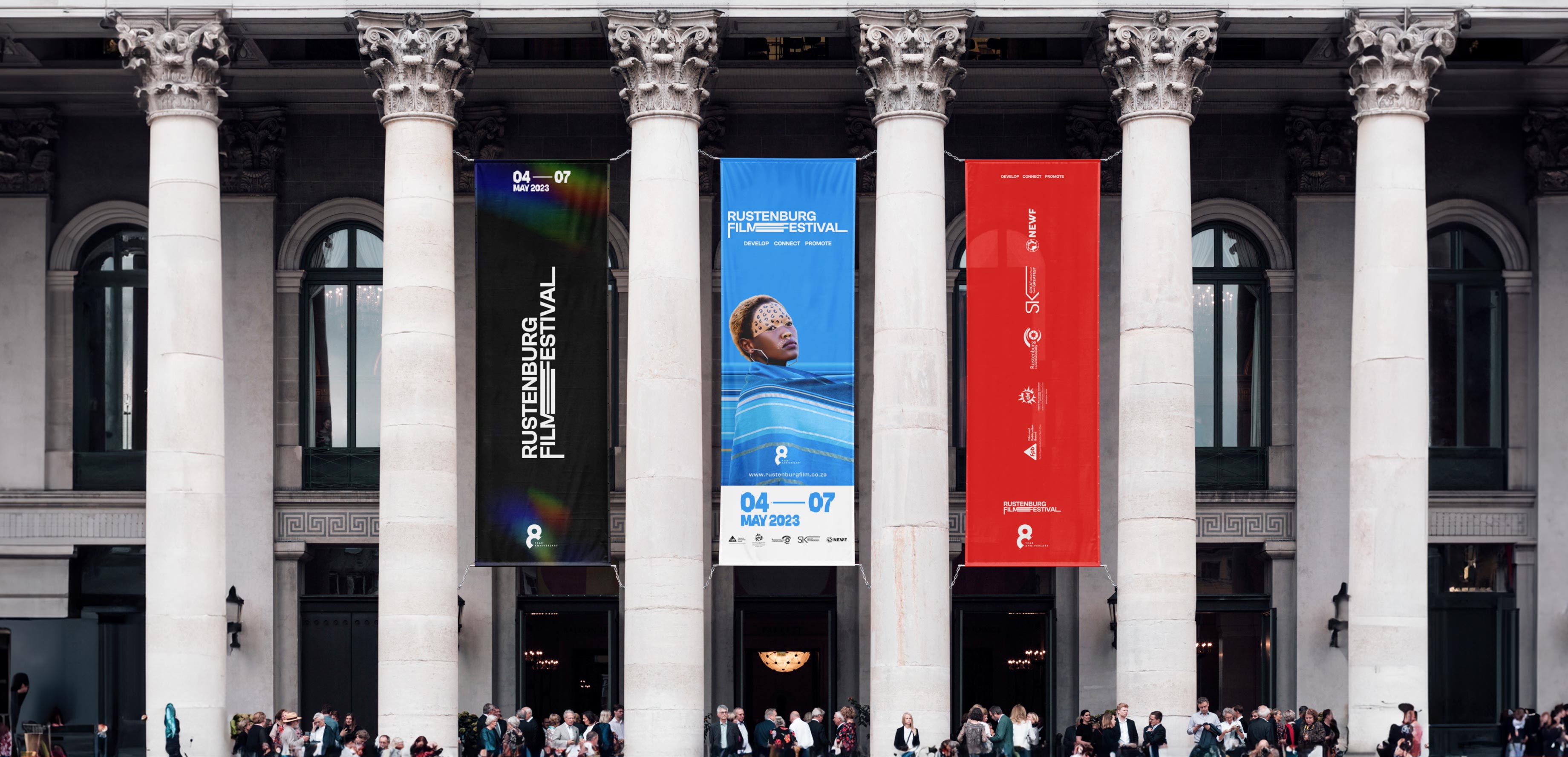 Wide shot of the RFF entrance, with branded banners draped from the columns of the building