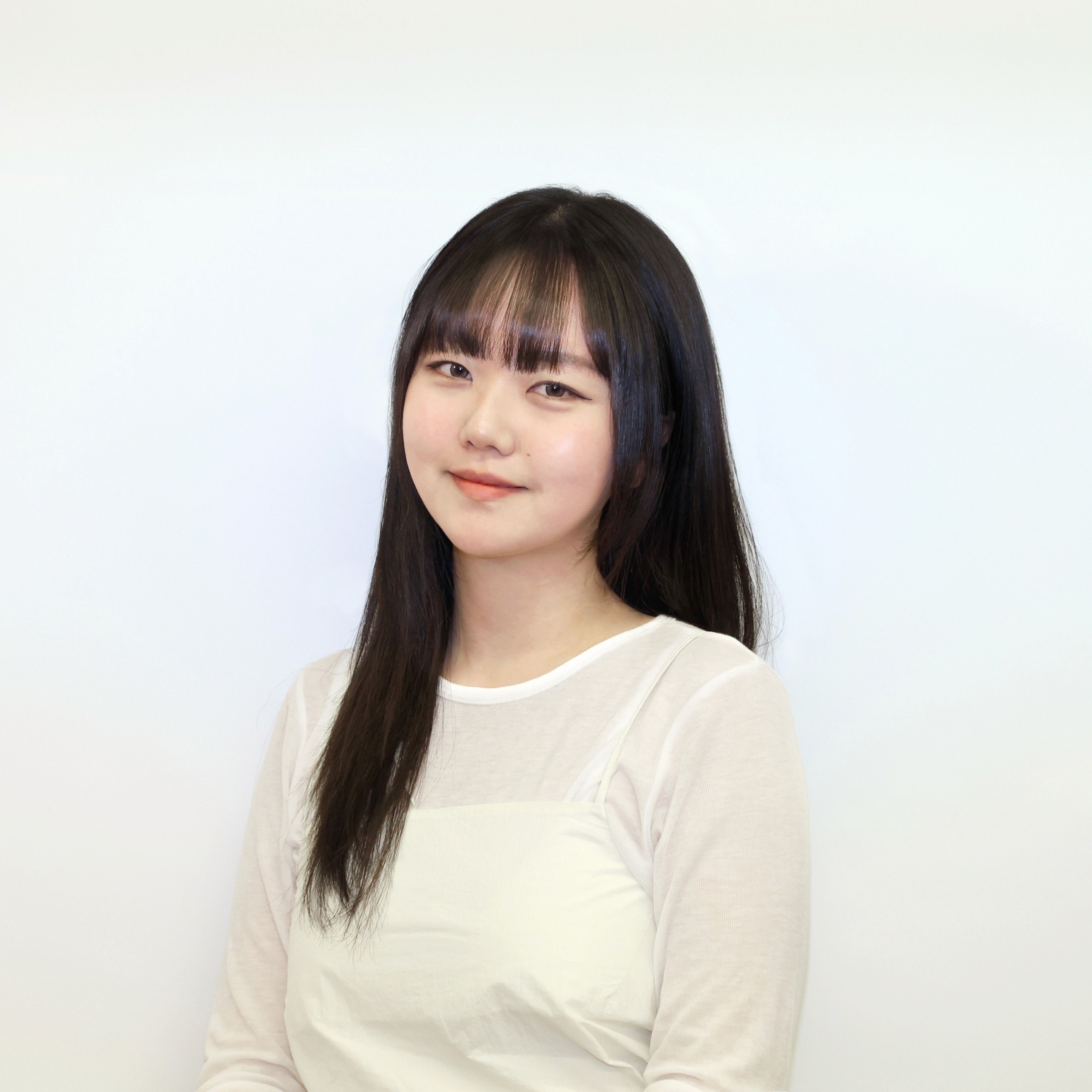 a blurry photo of a person standing in front of a wall