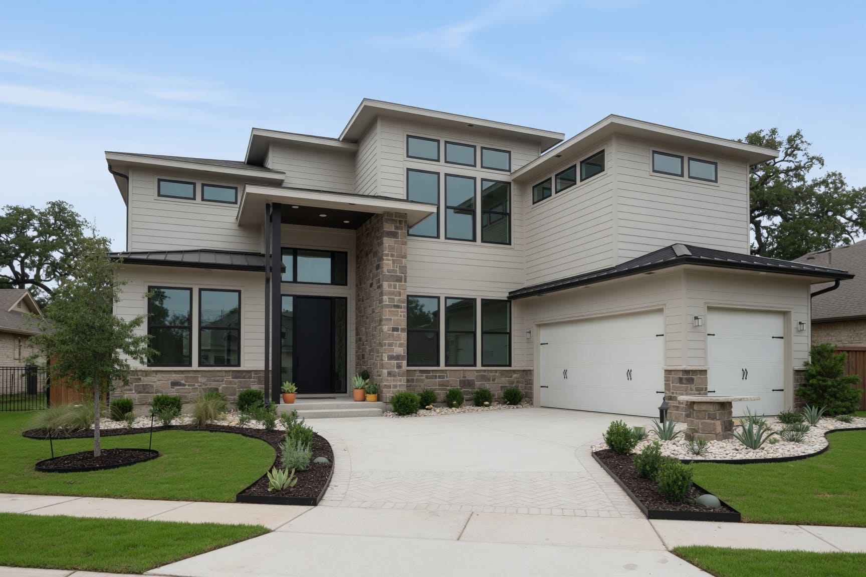 Contemporary home exterior with stone accents and two-car garage