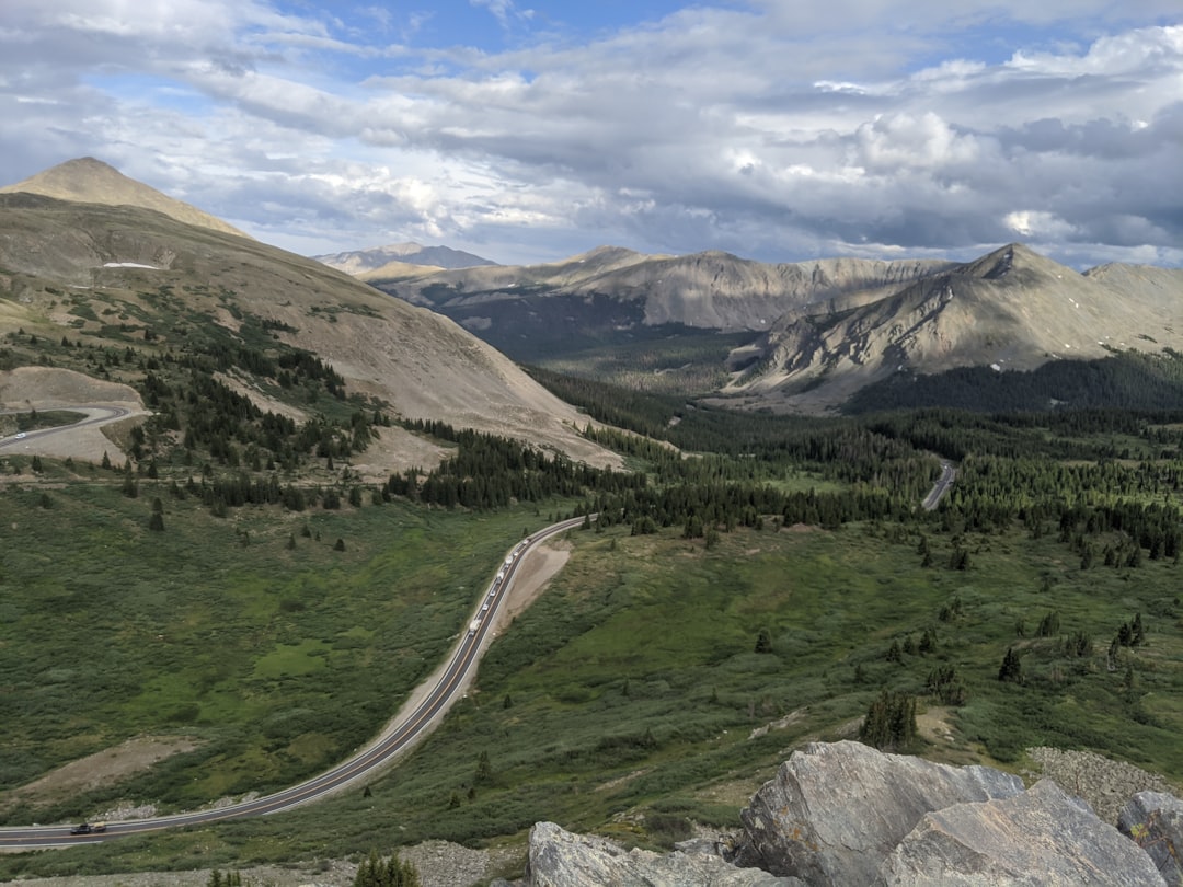 a view of a winding road in the mountains