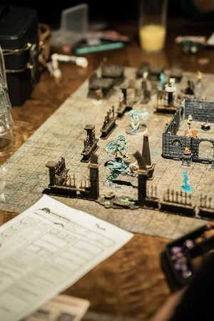 A close up view of miniature figurines set up for a table top role-playing game