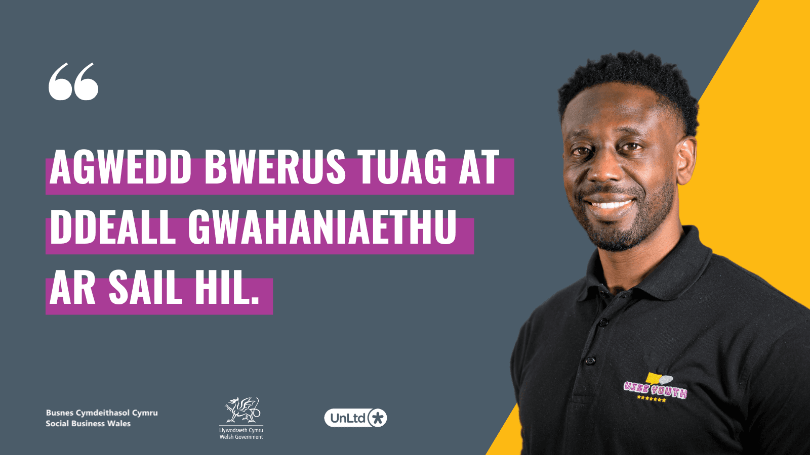 A man smiling to the camera in a black top and a graphic of a quote in Welsh highlighted in purple.