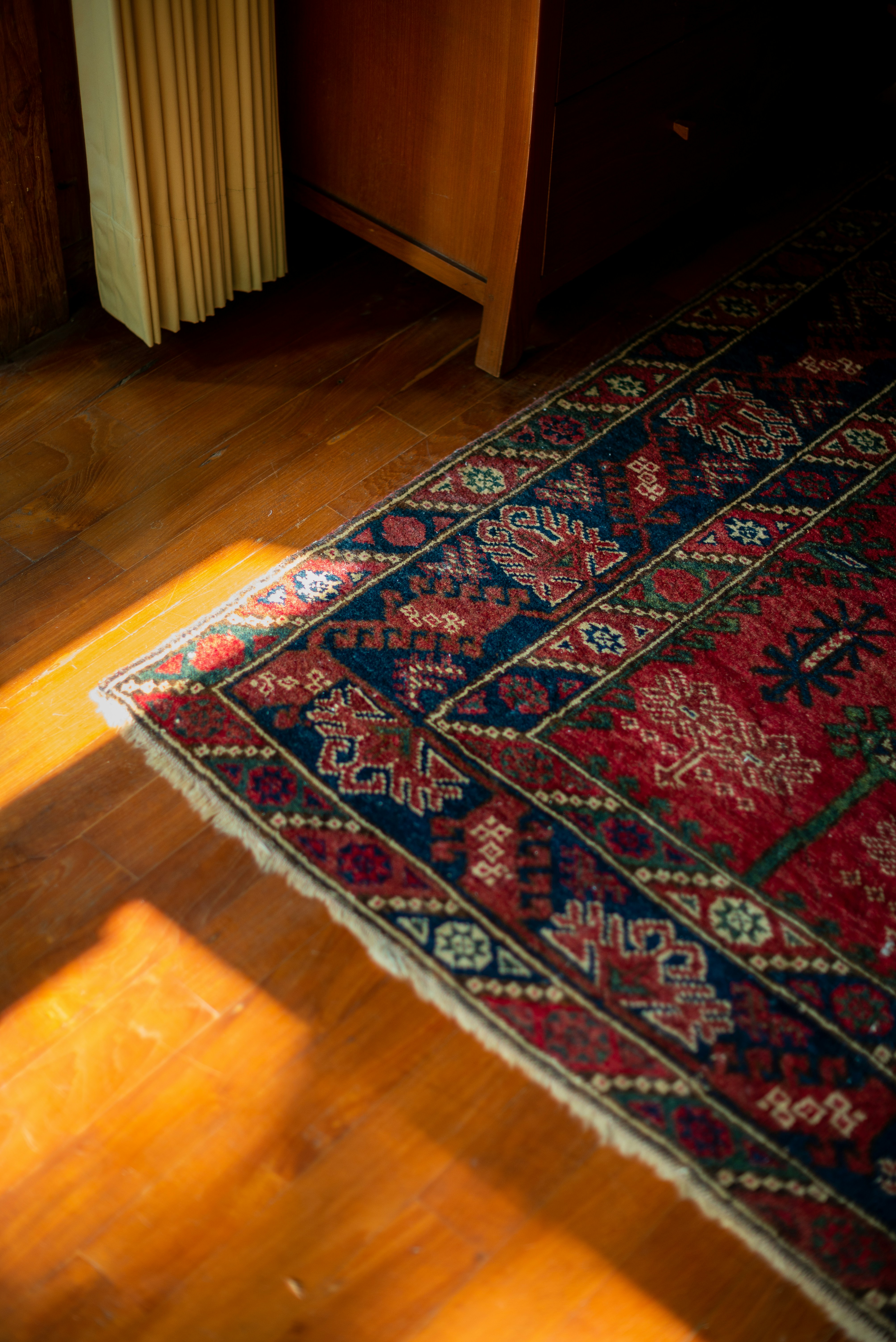 A wooden floor with a rug on top of it