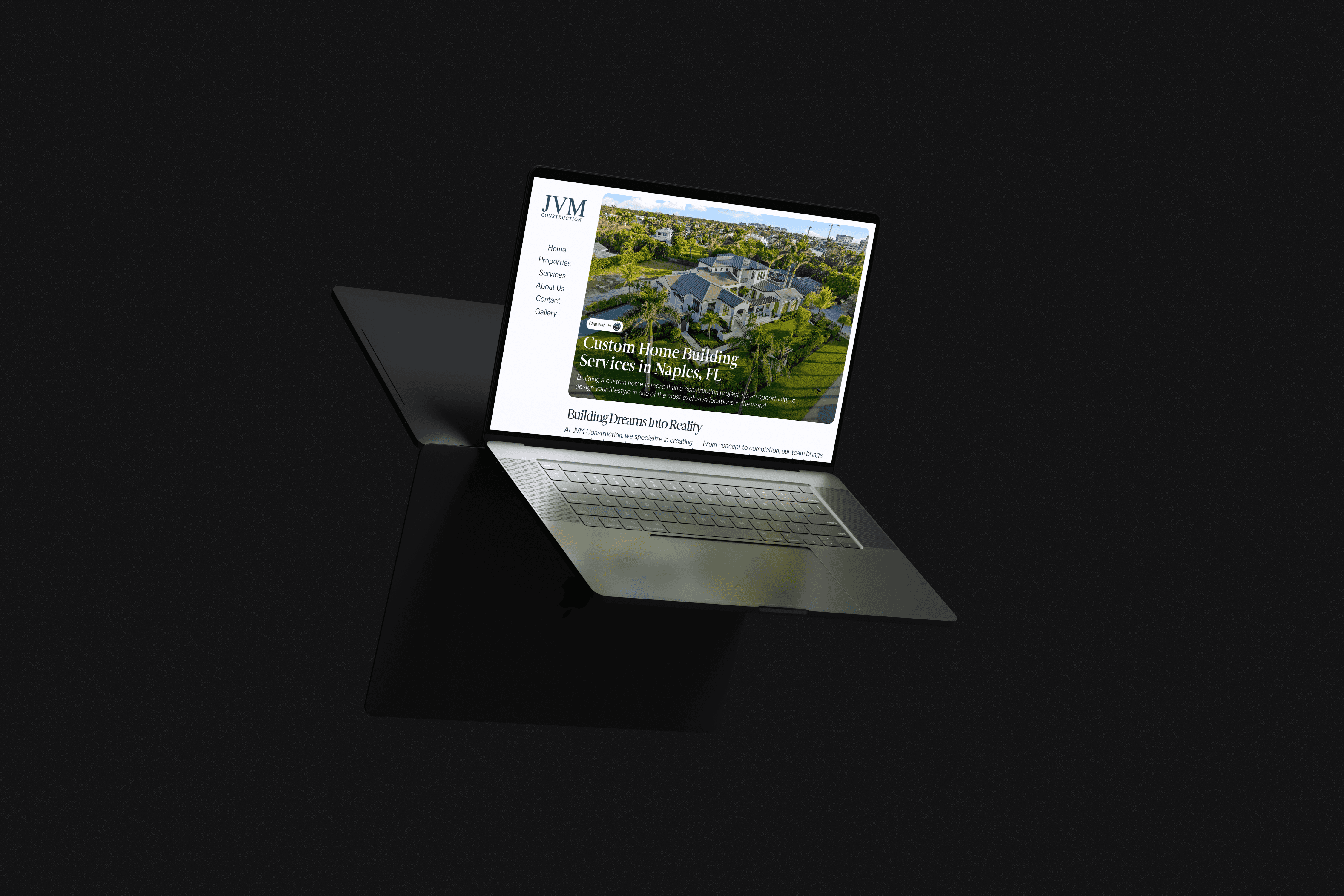 a floating laptop in a dark studio setting showcasing a website