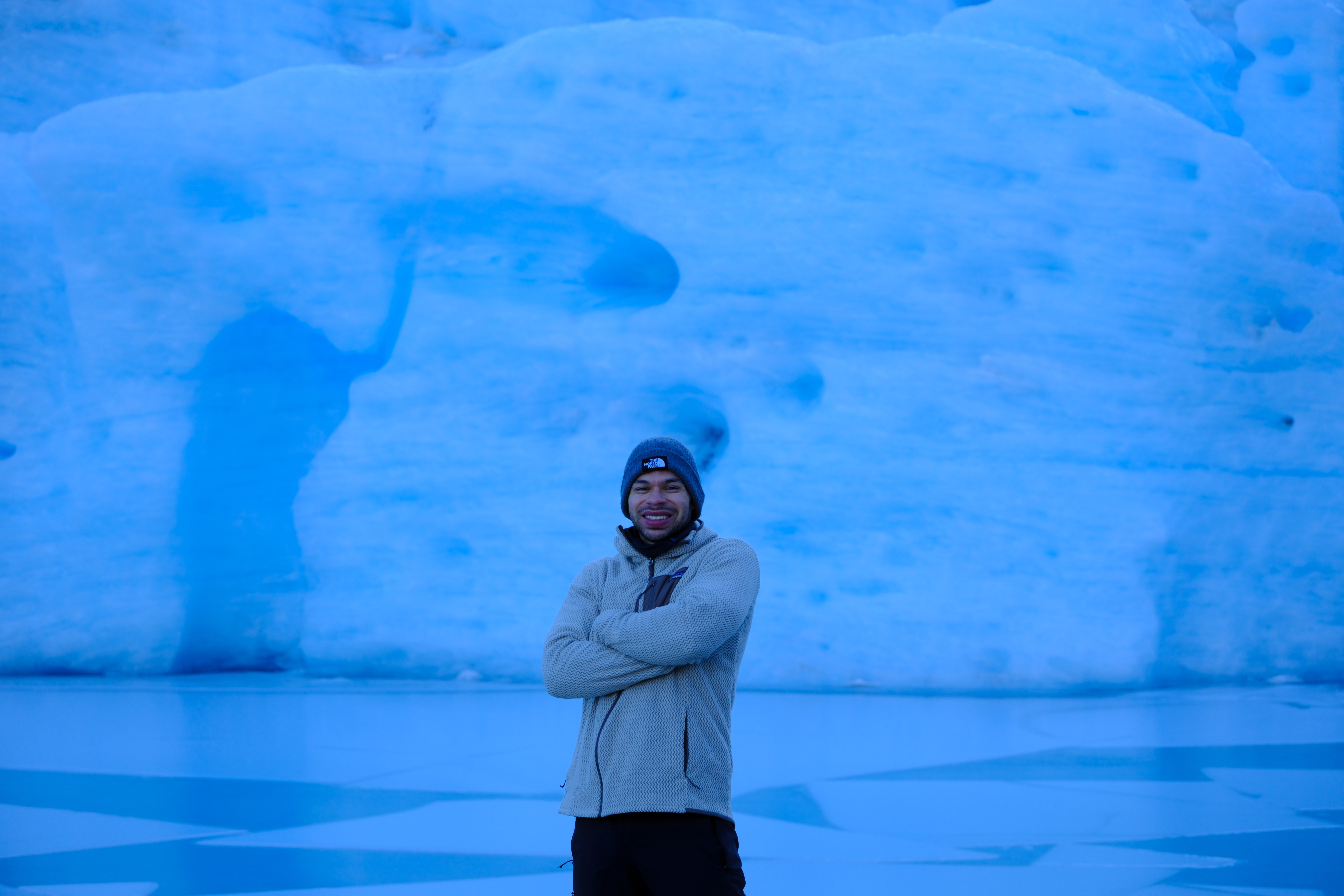 Nathan Gee in front of glacier ice