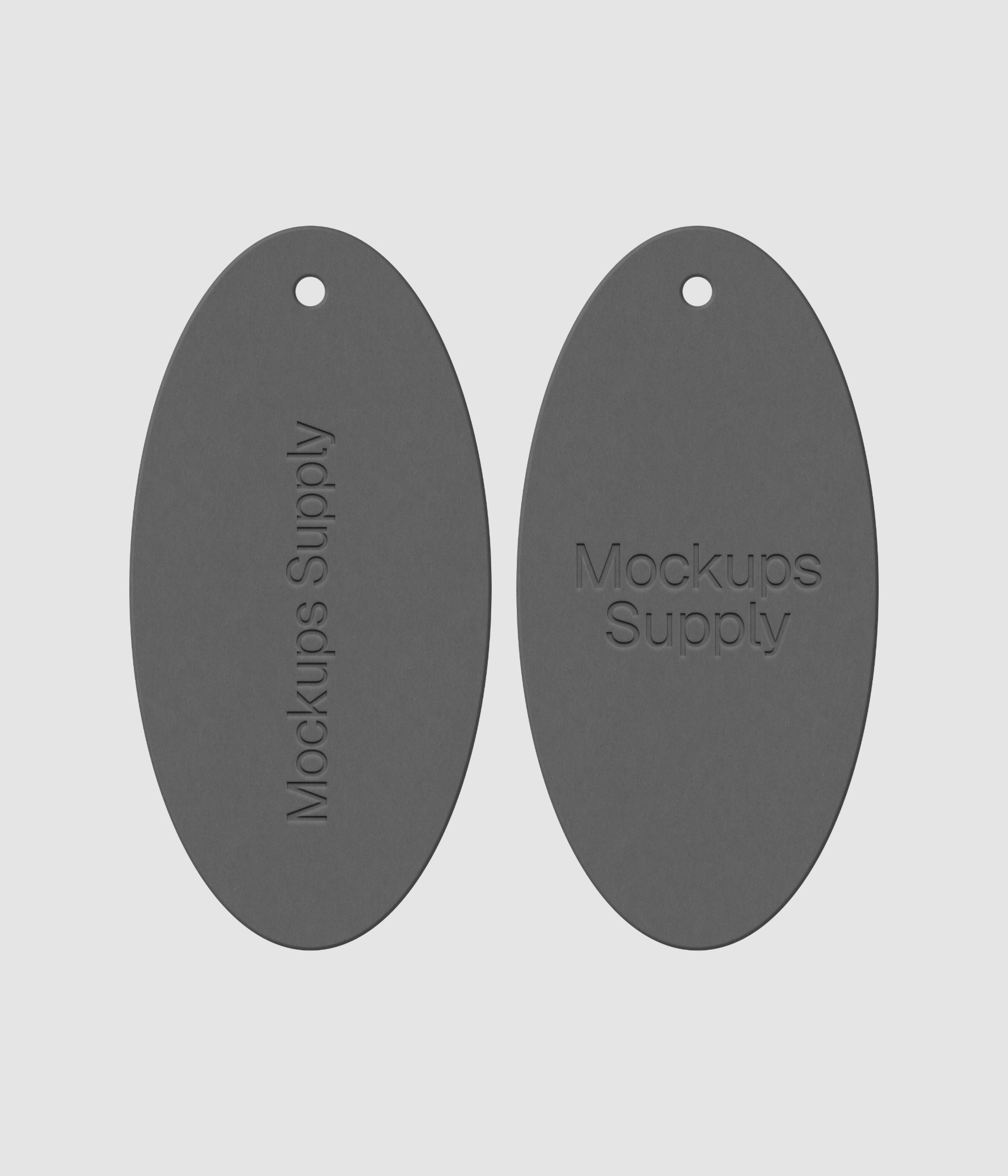 Pair of white elongated oval clothing tags featuring embossed branding on dark surface for premium fashion mockup collection