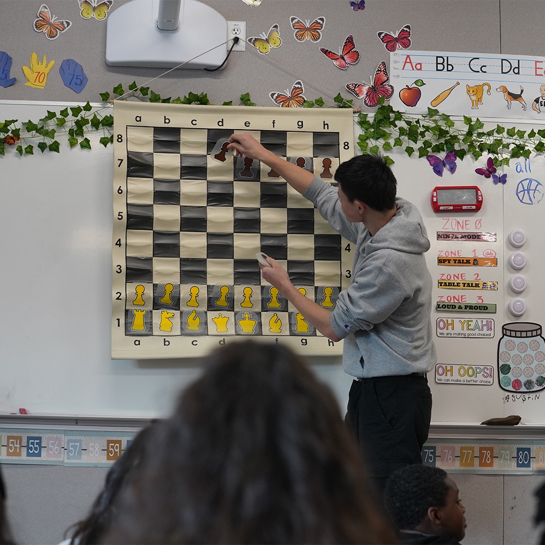 Kids practicing chess openings and tactics in school-based enrichment class