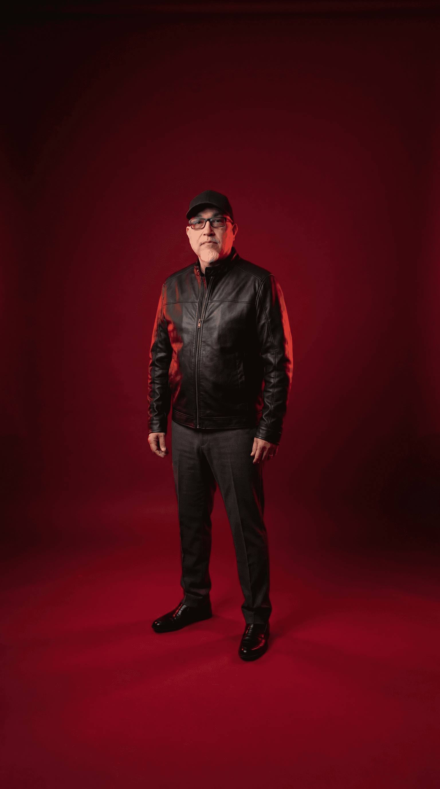 Paul in a red lit studio