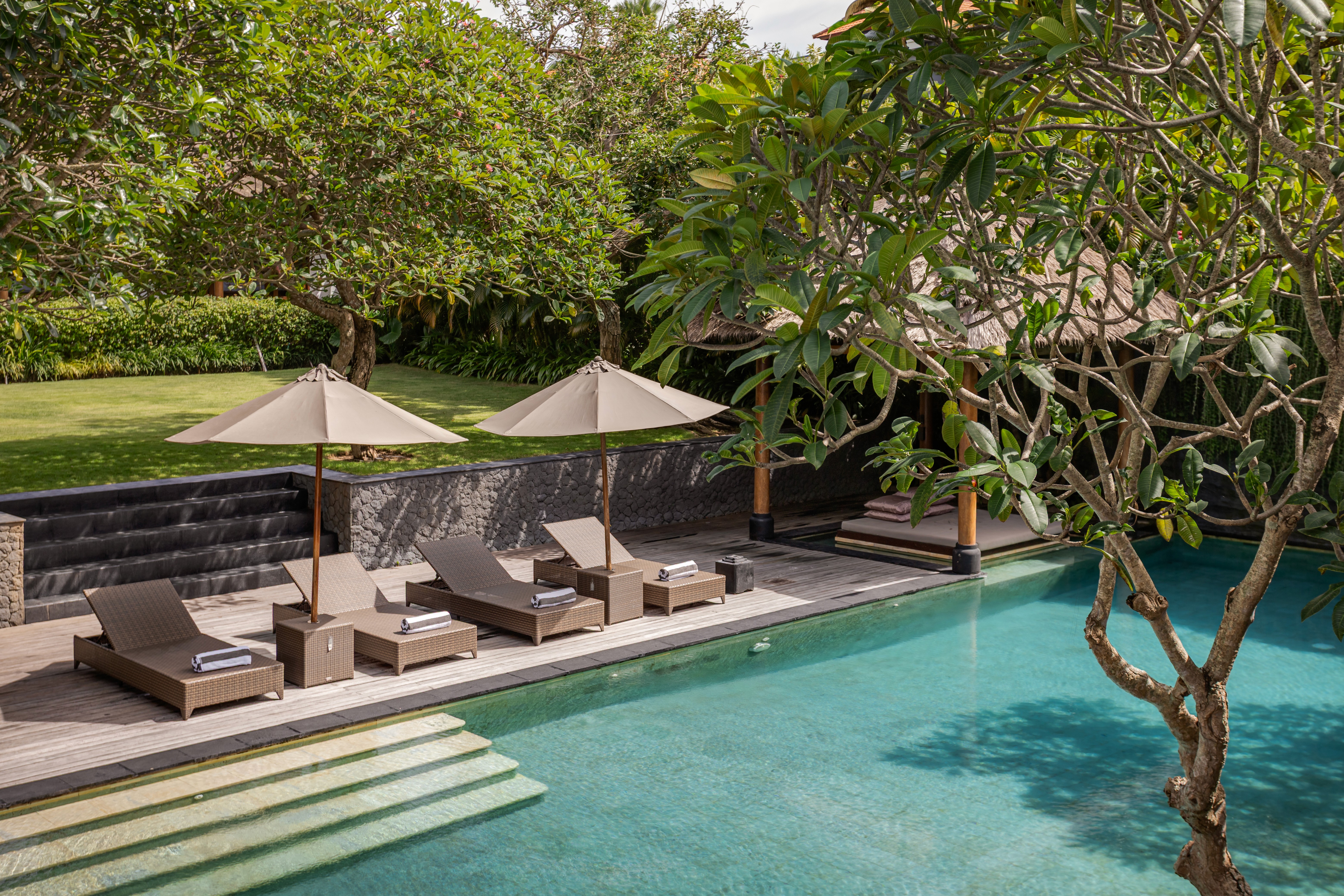 Modern hillside home with terracotta urn and mountain view