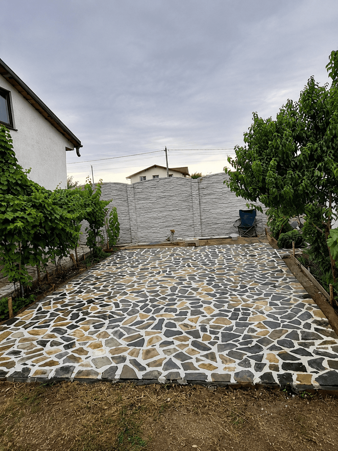 A house with a lawn and landscaping in front of it