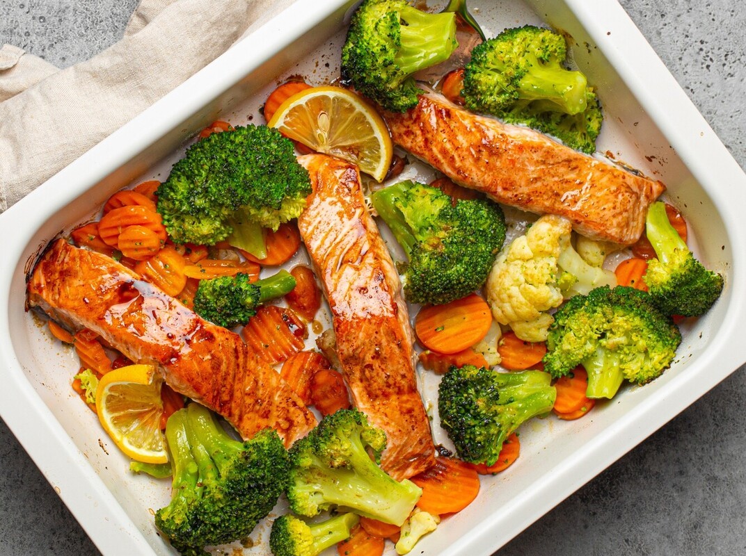 baked salmon and vegetables, showing how to use Epsom salt bath for weight loss in reality with nutrition first