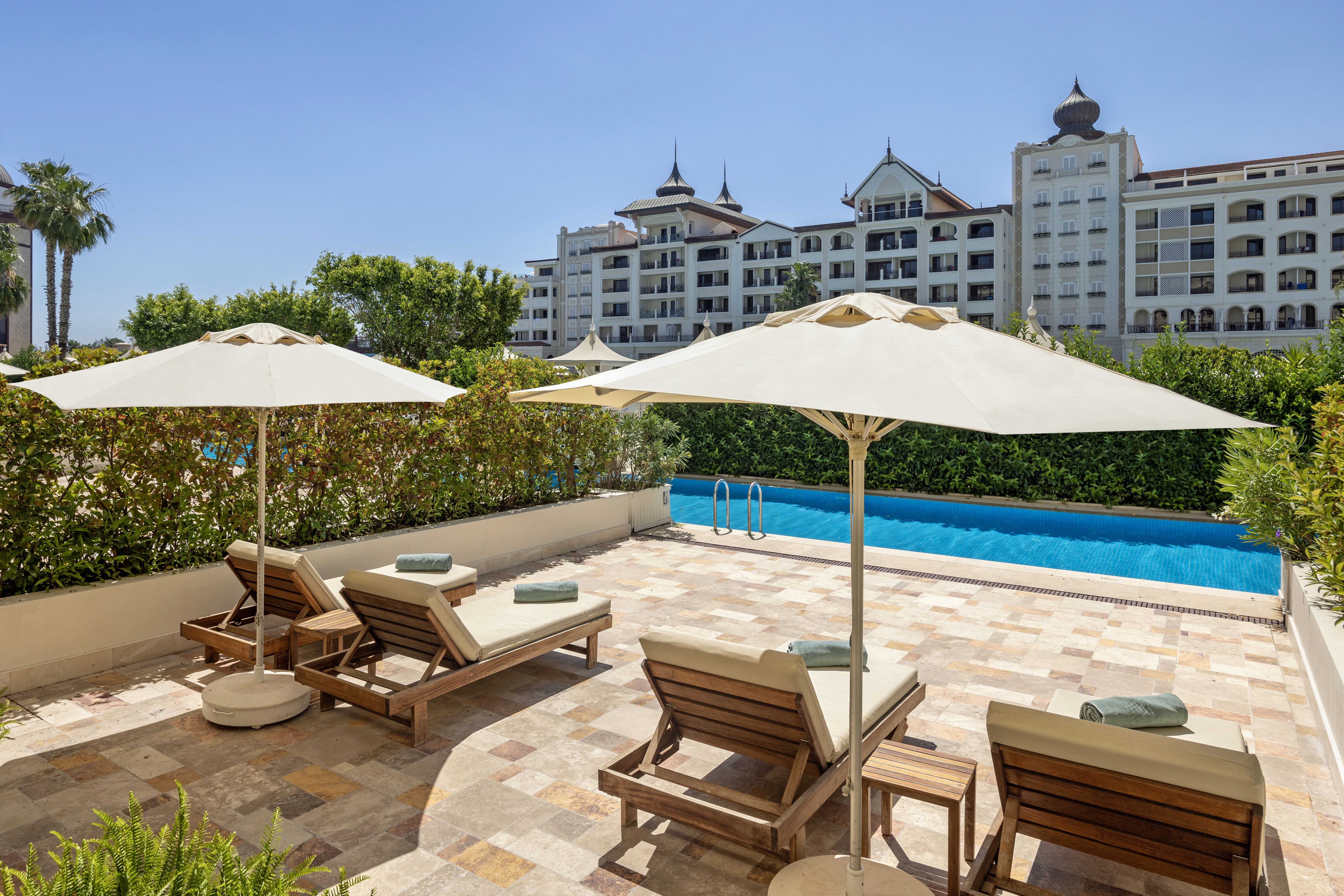 Premium pool duplex suite with private terrace and direct pool access.