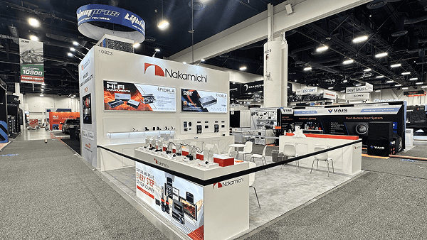 A SEMA booth arranged for stronger vehicle presence, clearer circulation, and better visibility in a busy automotive hall environment.