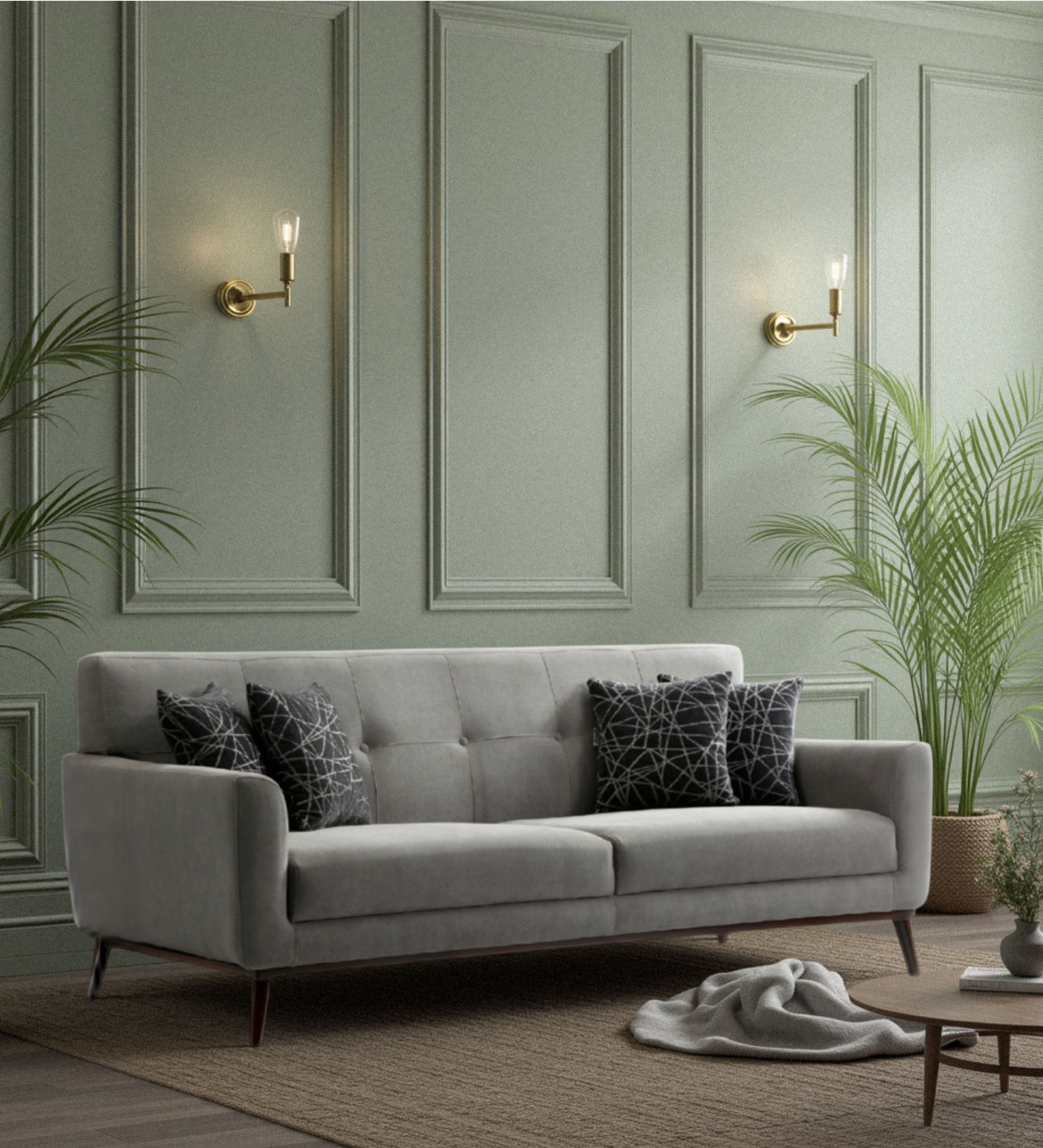 Light grey upholstered seating with button‑tufted backrest, straight arms, tapered wooden legs, and patterned accent cushions