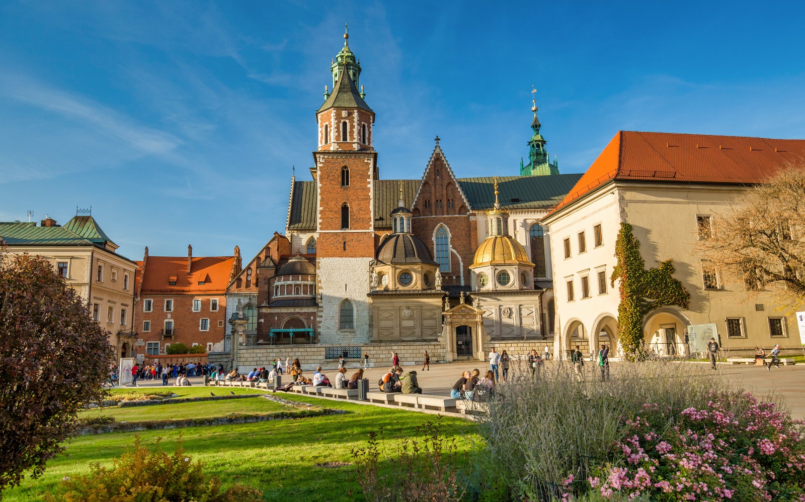 Wawel Castle and Cathedral in Krakow with visitors exploring the grounds.