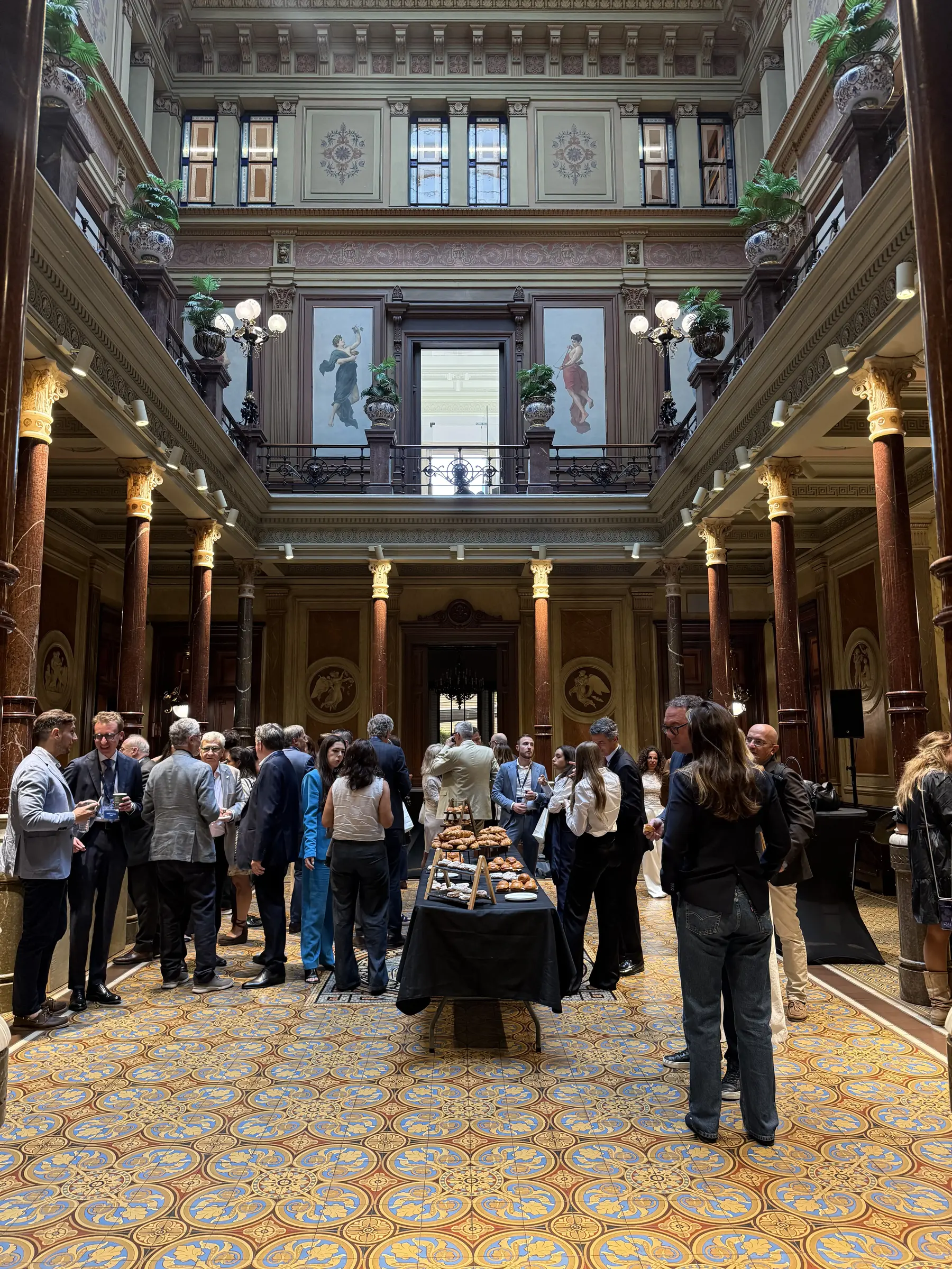 Guests gathered in an ornate hall
