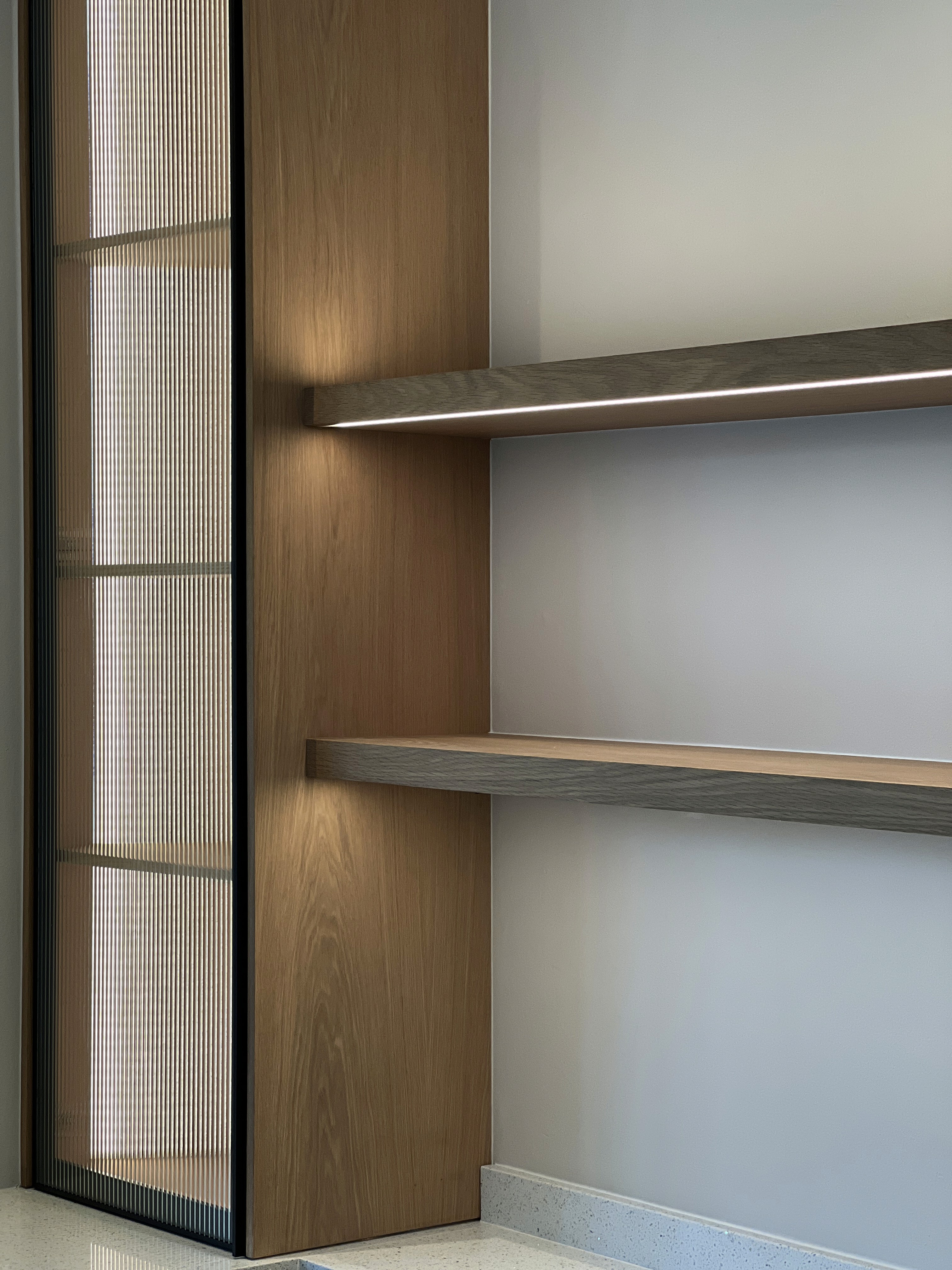 Front view of a modern wooden architecture building on grass with blue sky.