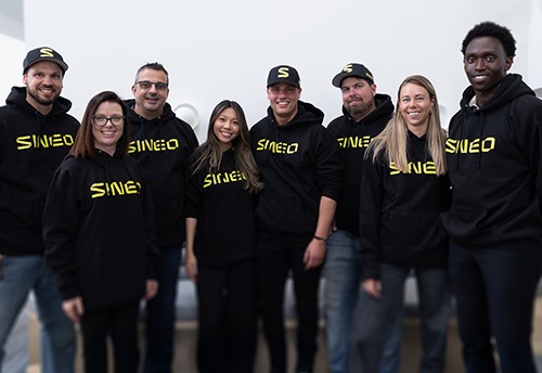 Team Sineo posing together, showcasing a mix of expertise.