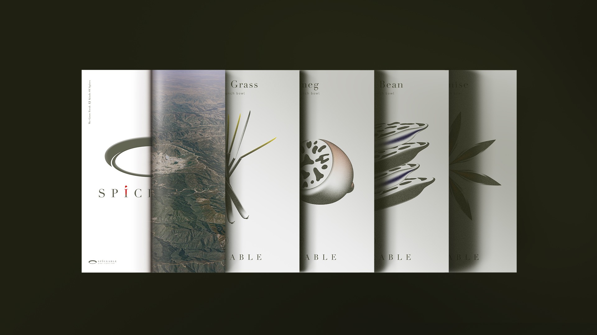 short books layered in a row with illustrated covers on dark background