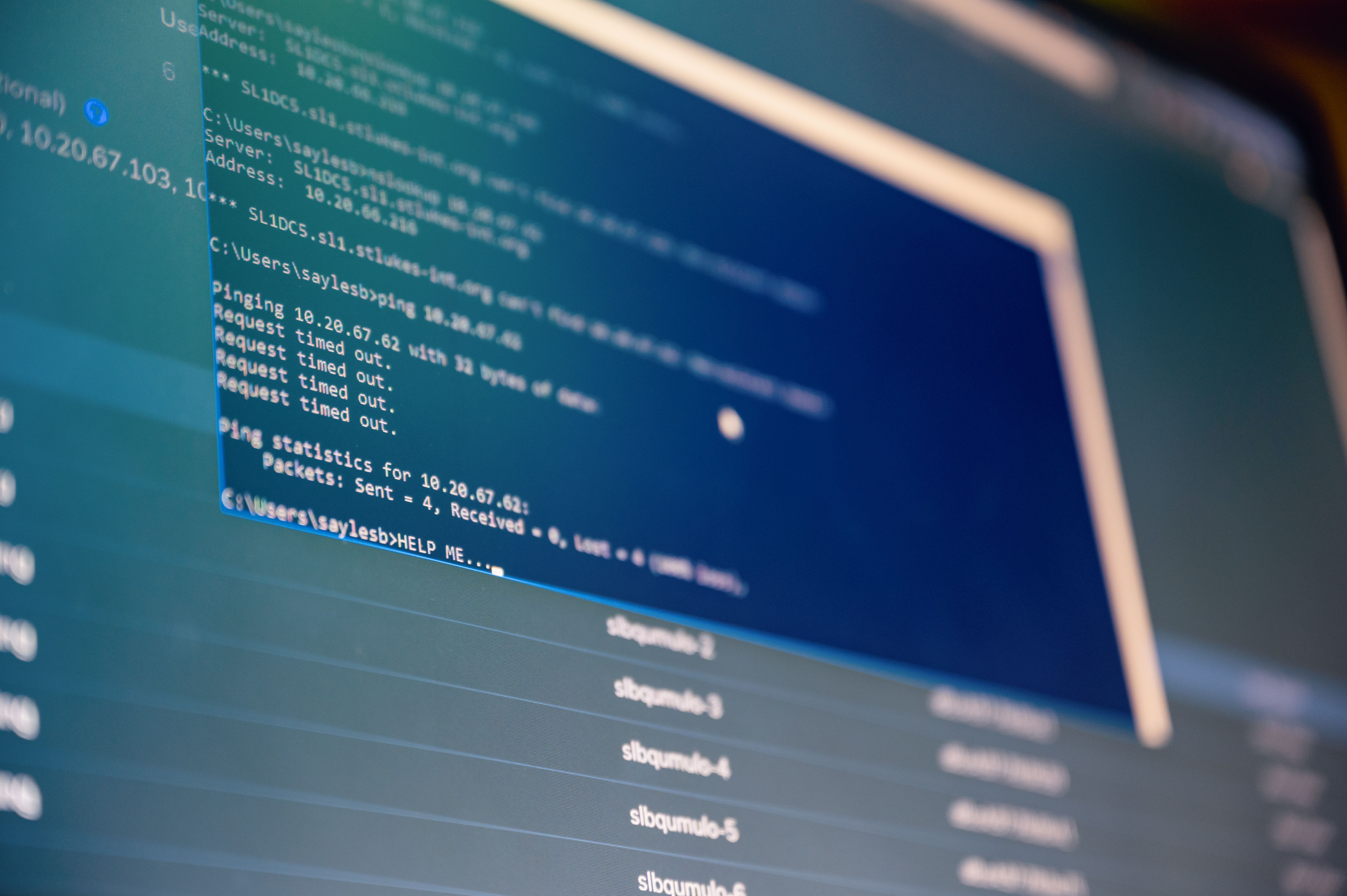 from-below-of-monitor-of-modern-computer-with-opened-files-on-blue-screen - brett-sayles (pexels)