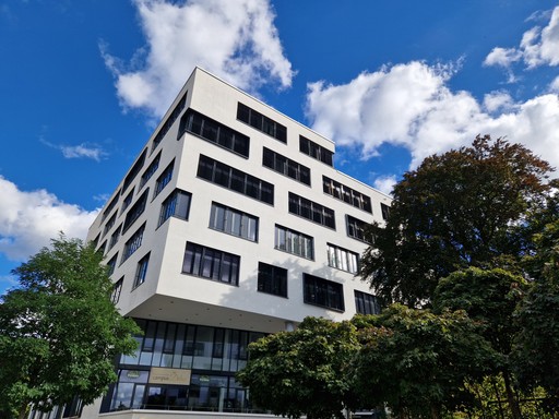 Droptical company building surrounded by trees in the heart of Nuremberg