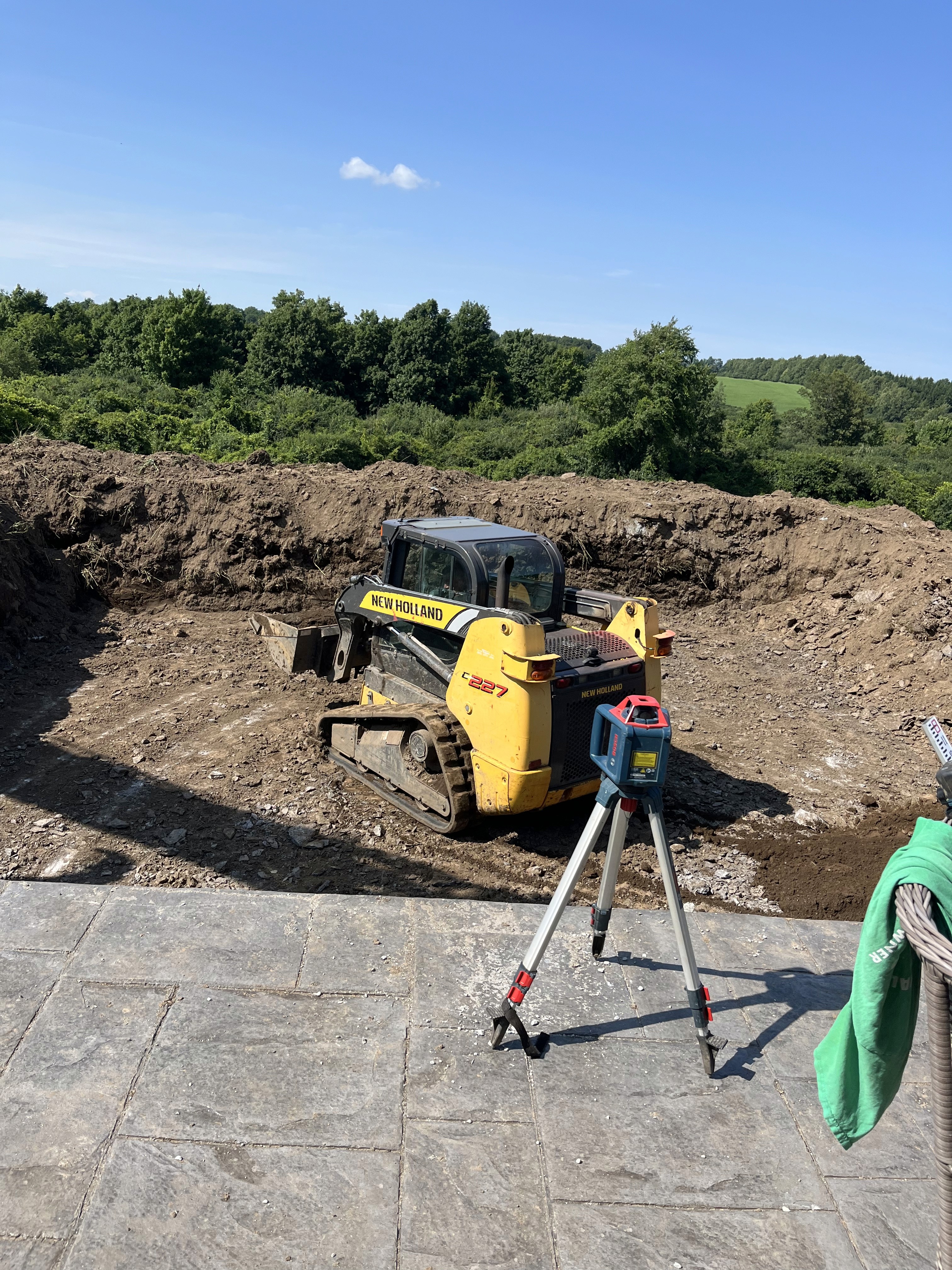 yellow and black heavy equipment on brown soil