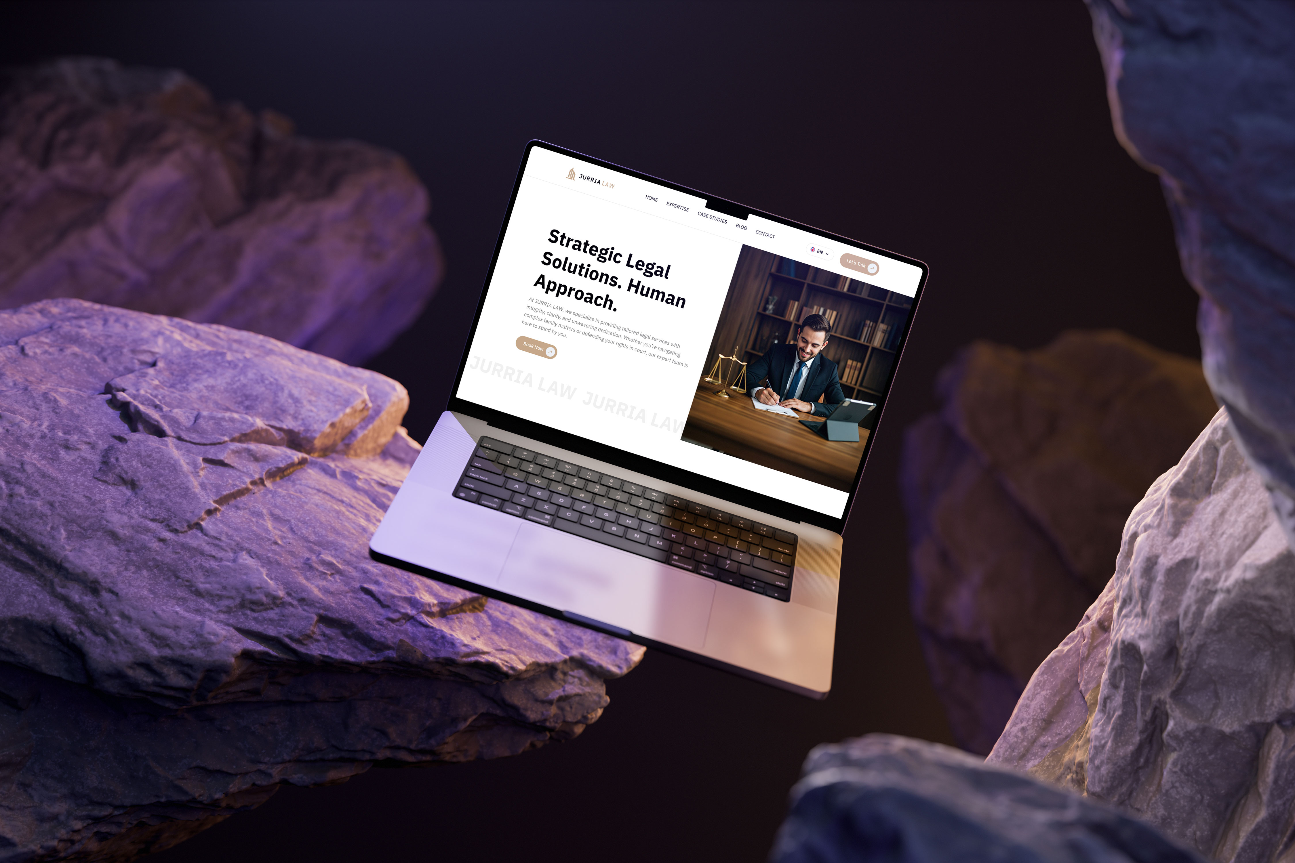 Laptop displaying a law firm website.  The site features images and text about legal solutions and a human approach.