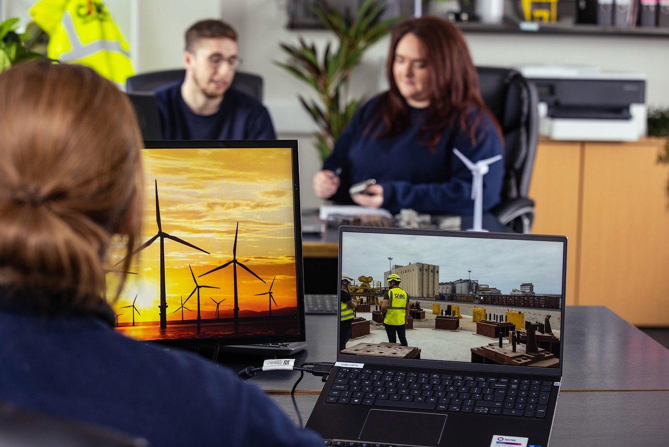 CASC team reviewing offshore wind project visuals during a collaborative design meeting.