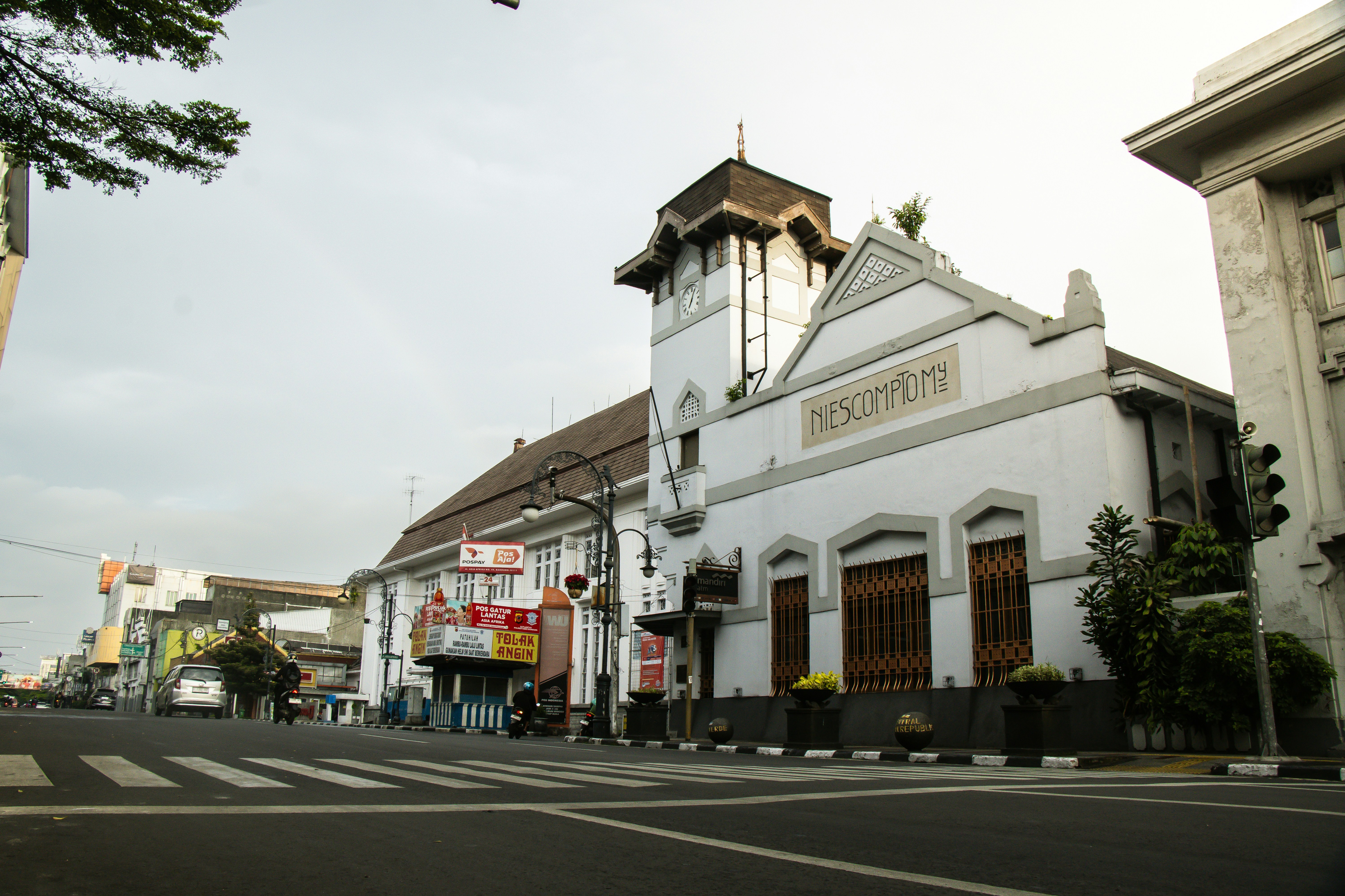 A historic building stands on a quiet street.