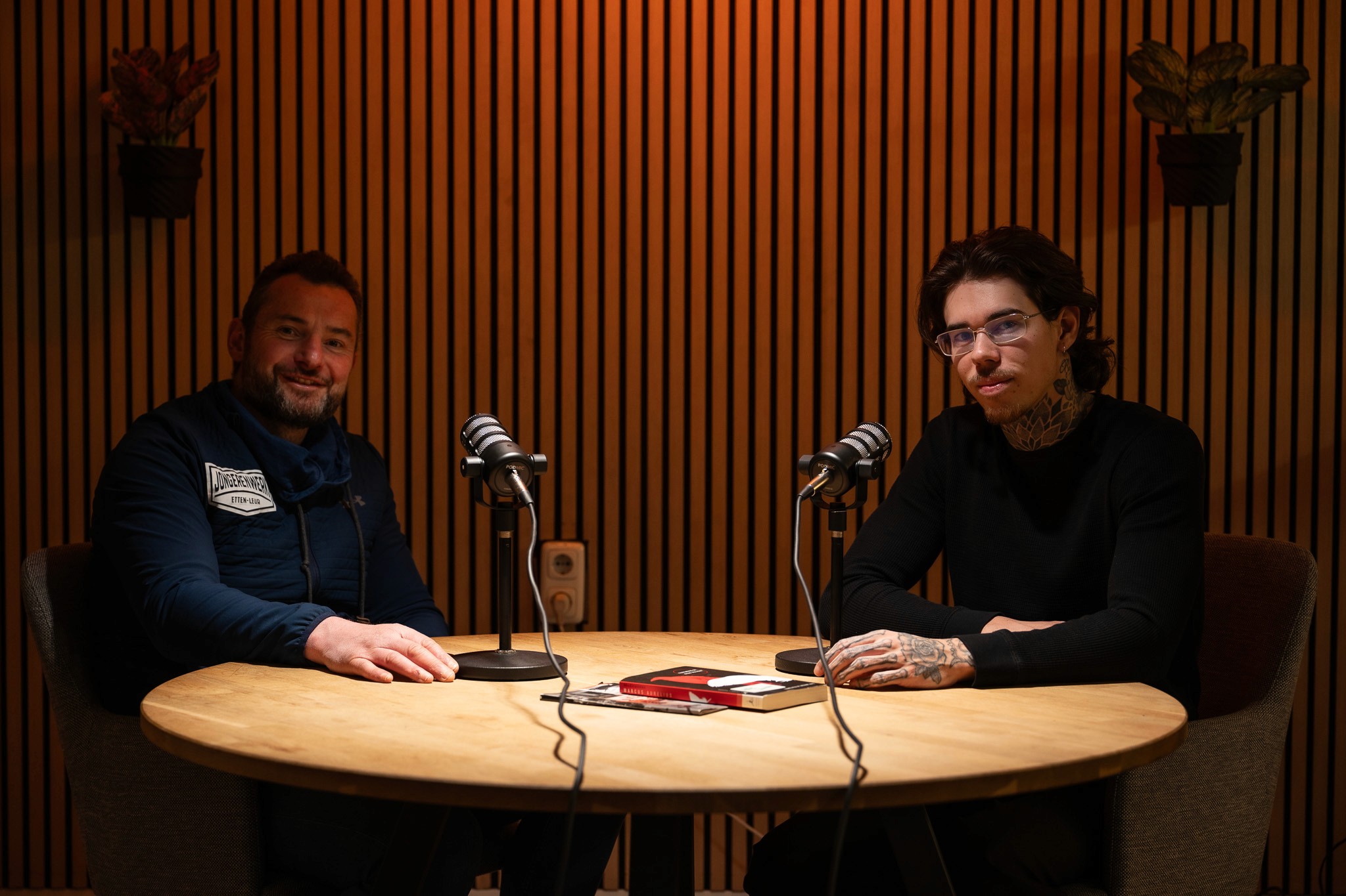 Group of men standing with Sufboard