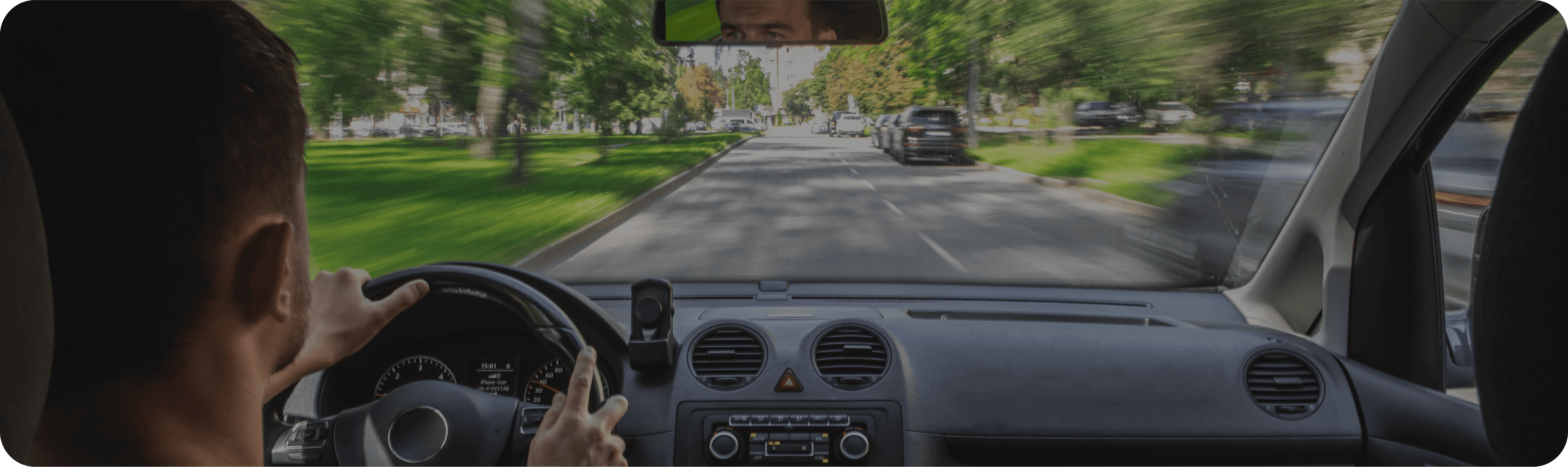 Inside a car driving down a street