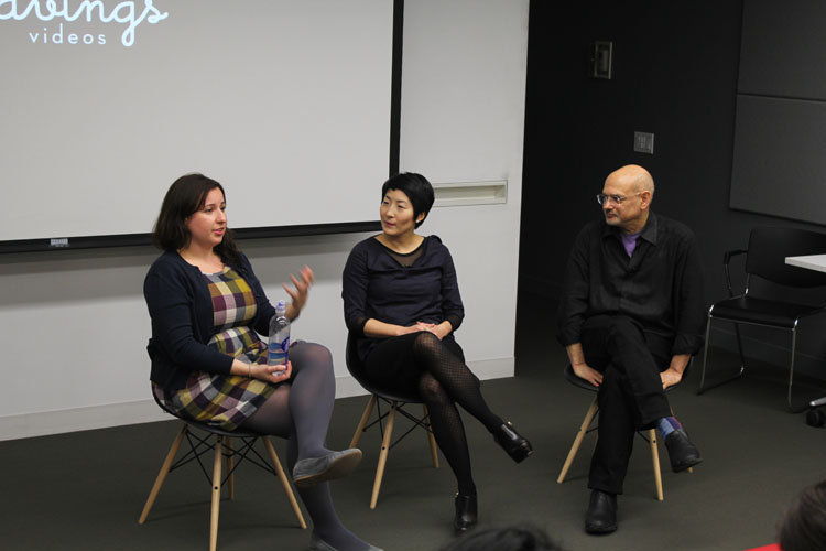 A photo of two women and a man giving a lecture.