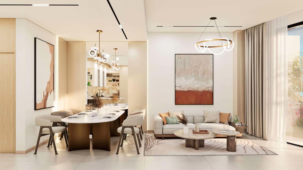 A modern living room featuring a stylish dining table with chairs, showcasing the elegant design of Xenia Residences.