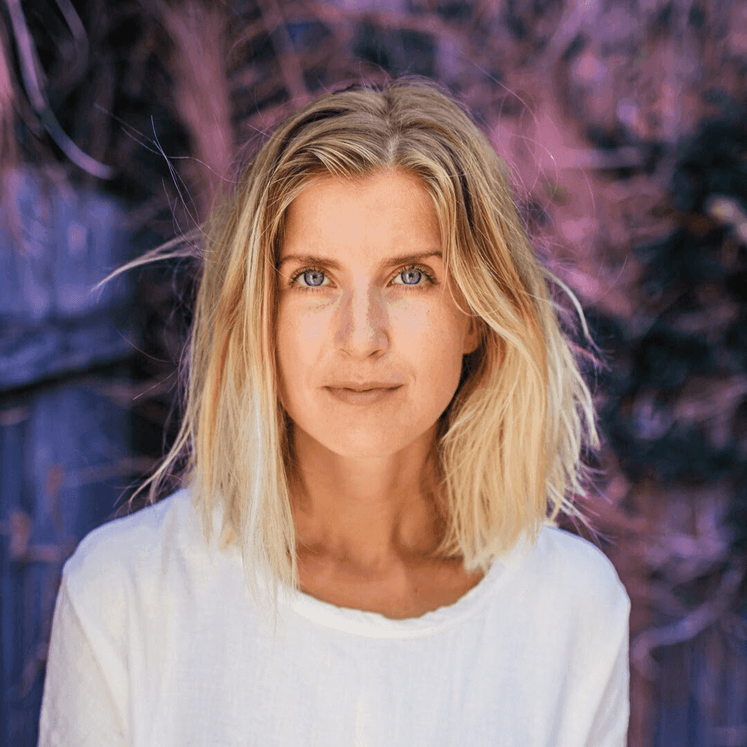 Professional photo of a health practitioner against a pink and purple backdrop