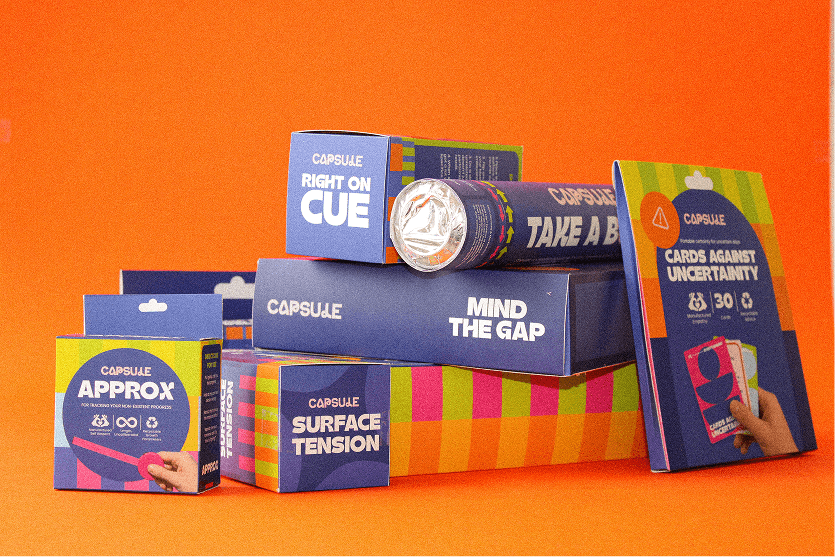 A fast black sports car races down the highway.