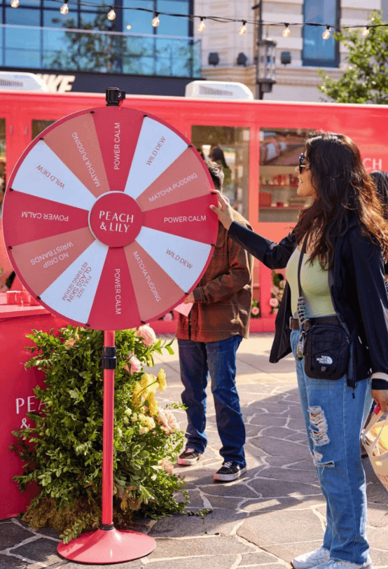 Palm trees frame a dramatic mountain valley landscape