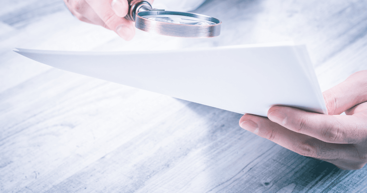 Magnifying glass over legal documents for Case Evaluation at Fibi Law