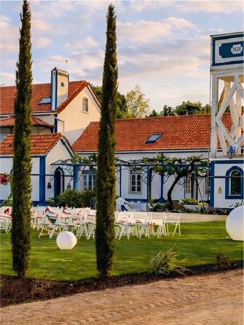 A building with green shutters and a white umbrella