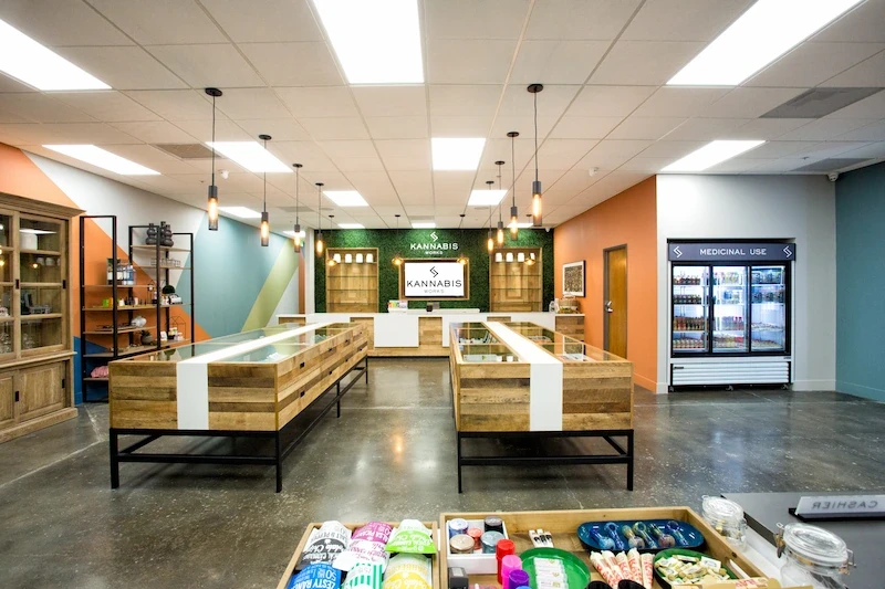 Kannabis Works retail space with display cases, product shelves, and pendant lighting.
