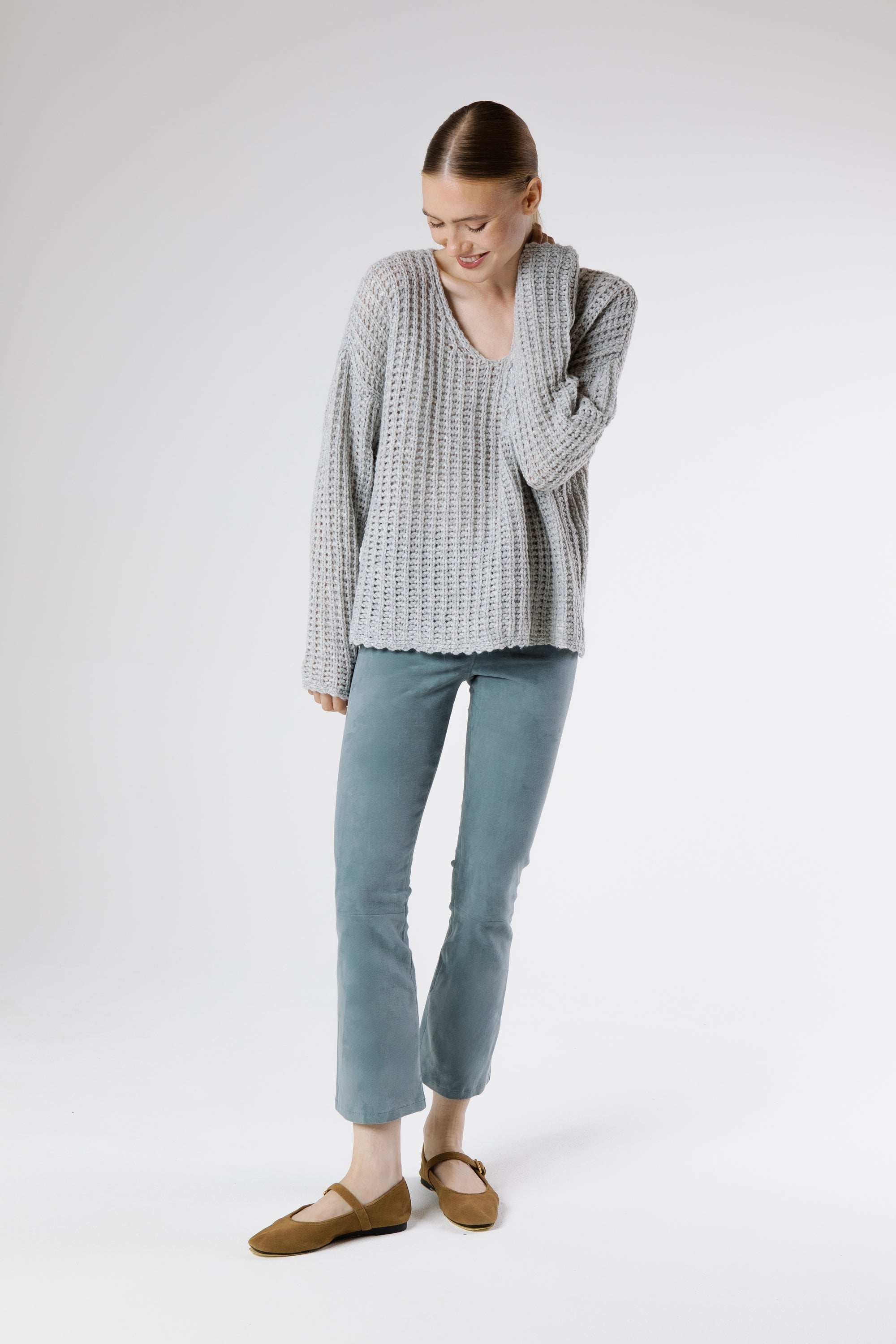 Model wearing the Napoli VE Suede Trousers Capri styled with a textured knit and delicate flats for a modern, sophisticated look.