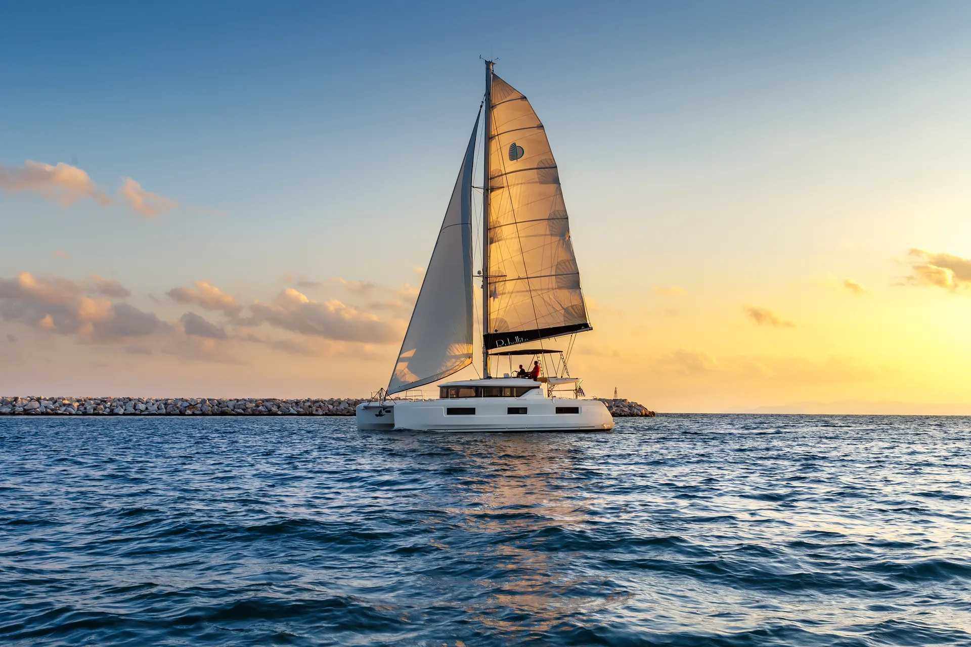 White Rock 36 speedboat with captain at helm cruising calm blue waters near Paros coastline with hills in background.
